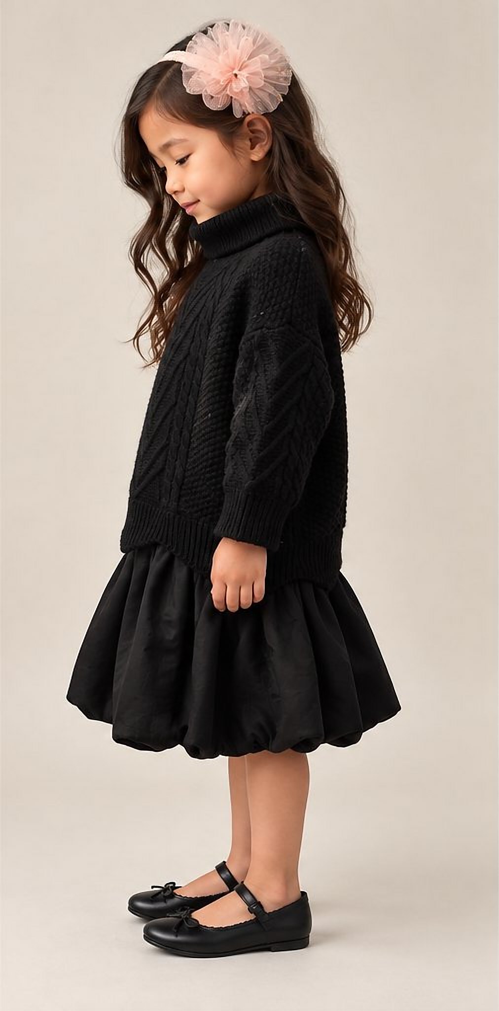 The black cable knit dress in profile