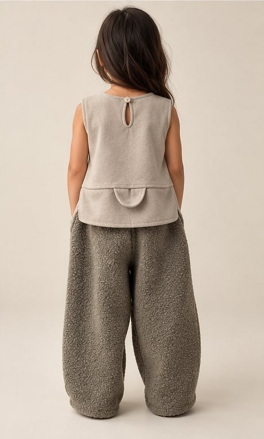 The cream top and sherpa trouser set from behind
