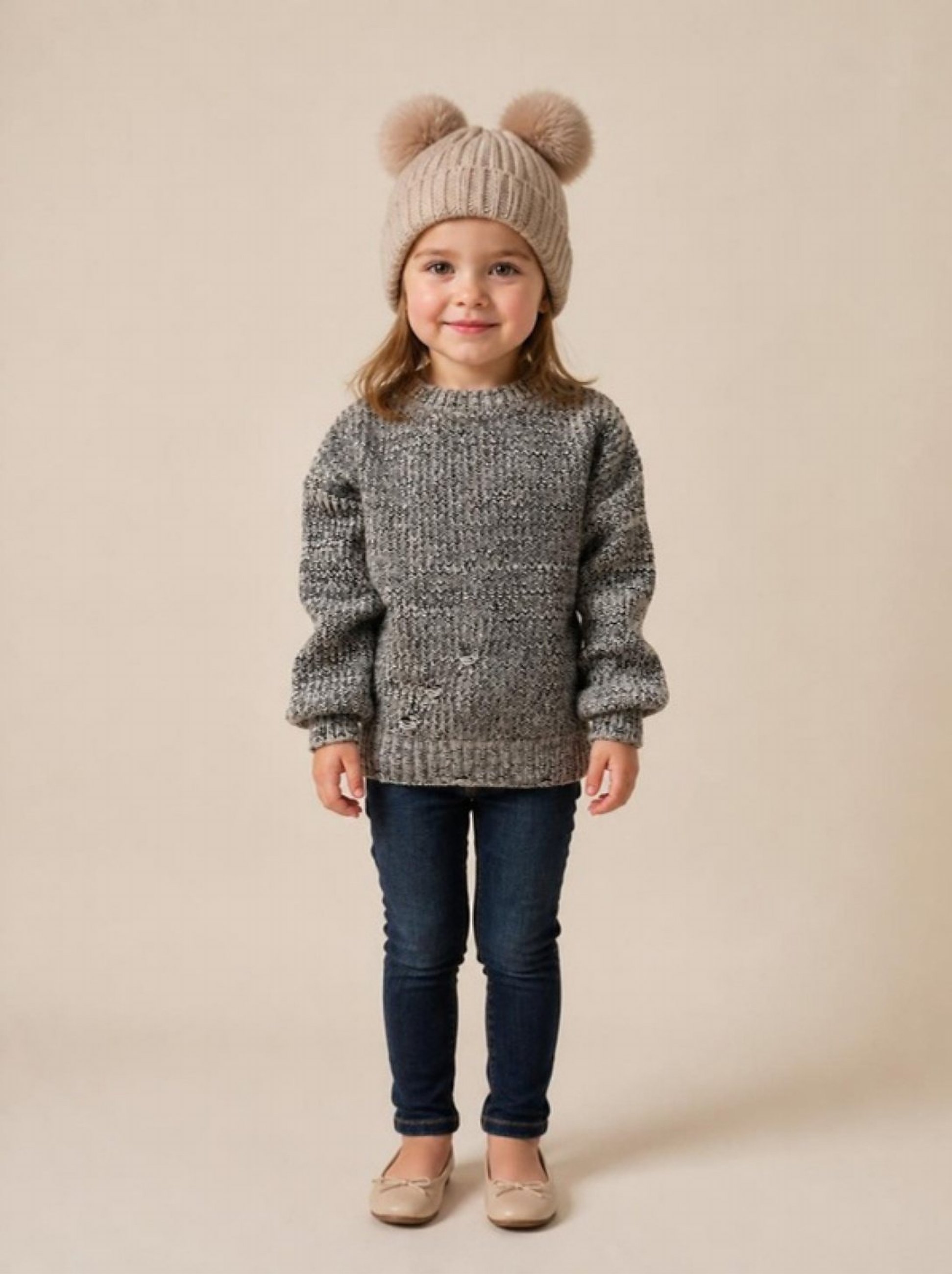 A girl in the marled crew sweater and pom-pom beanie