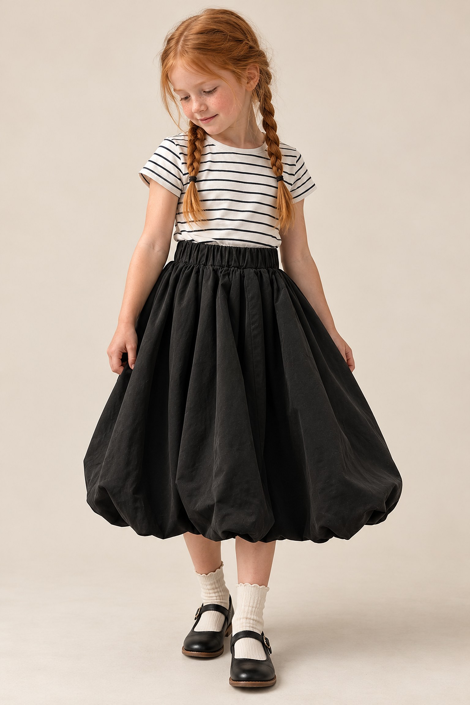 A girl in the stripe tee and bubble skirt set